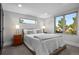 Serene bedroom with large windows providing natural light and neighborhood views at 2523 N Humboldt St, Denver, CO 80205