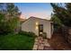 A well-kept garage and stone path with low-maintenance landscaping make for a welcoming exterior view at 2523 N Humboldt St, Denver, CO 80205