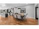 Elegant dining room with hardwood floors, stylish chandelier, and seating for six at 2523 N Humboldt St, Denver, CO 80205