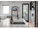 Close-up view of a modern kitchen island featuring a stainless steel faucet and undermount sink at 2523 N Humboldt St, Denver, CO 80205