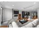 Open concept living space with a fireplace, hardwood floors, and a comfortable sectional sofa at 2523 N Humboldt St, Denver, CO 80205