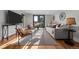 Bright living room featuring hardwood floors, neutral paint, and balcony access at 2523 N Humboldt St, Denver, CO 80205