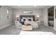 Comfortable main bedroom with stylish headboard, lamps, and a sitting area at 2523 N Humboldt St, Denver, CO 80205