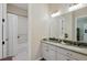 Classic bathroom featuring a marble countertop vanity, vintage fixtures, and a shower with white curtain at 17240 Hop Clover Ave, Parker, CO 80134