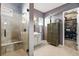 Bathroom includes a glass-enclosed shower with bench and an adjacent walk-in closet for ample storage space at 17240 Hop Clover Ave, Parker, CO 80134