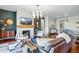 Spacious living room with a modern fireplace, comfortable seating, and a stylish coffee table at 17240 Hop Clover Ave, Parker, CO 80134