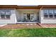 Inviting covered patio featuring comfortable seating and an elegant chandelier at 17240 Hop Clover Ave, Parker, CO 80134