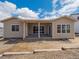 Back of home featuring a covered patio and yard with beautiful blue sky at 4735 Twelve Oaks Way, Castle Rock, CO 80104