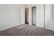 Spacious bedroom with plush carpeting, an open closet and easy access to an ensuite bathroom at 4735 Twelve Oaks Way, Castle Rock, CO 80104
