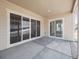 Covered patio with new concrete and sliding glass doors leading inside at 4735 Twelve Oaks Way, Castle Rock, CO 80104