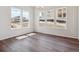 Dining area featuring hardwood floors and large windows, offering ample natural light and views at 4735 Twelve Oaks Way, Castle Rock, CO 80104