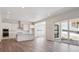 Open-concept kitchen flowing into the living area, featuring modern appliances and plenty of counter space at 4735 Twelve Oaks Way, Castle Rock, CO 80104