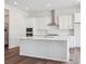 Bright, spacious kitchen with white cabinets, stainless steel appliances, and a large center island at 4735 Twelve Oaks Way, Castle Rock, CO 80104
