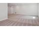 Spacious living room featuring neutral carpeting, fresh white paint, recessed lighting and a window at 4735 Twelve Oaks Way, Castle Rock, CO 80104