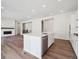 Open-concept living area featuring hardwood floors, a fireplace, and a seamless flow to other living spaces at 4735 Twelve Oaks Way, Castle Rock, CO 80104