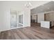 Open-concept living area with hardwood floors, sliding glass doors, and seamless flow to other living spaces at 4735 Twelve Oaks Way, Castle Rock, CO 80104