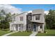 Beautiful new construction townhome featuring modern architecture and professional landscaping at 22823 E Tufts Ave # B, Aurora, CO 80015