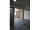 View from doorway in basement showing neutral carpet and support column to partially finished space at 28650 Cavan Ln, Evergreen, CO 80439