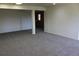 Open basement living space with neutral carpet and view of a doorway to another room at 28650 Cavan Ln, Evergreen, CO 80439