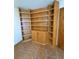 Built-in wooden bookshelf with doors and open shelving at 28650 Cavan Ln, Evergreen, CO 80439