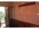 Rustic entrance with stone accents and weathered wood, leading to a doorway with a mountain view at 28650 Cavan Ln, Evergreen, CO 80439