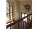 Bright foyer with stairs, tile floors, view of windows and high ceilings; a welcoming entrance to the home at 28650 Cavan Ln, Evergreen, CO 80439