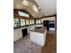 Spacious kitchen with an island and picturesque views from the many windows at 28650 Cavan Ln, Evergreen, CO 80439