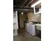 Basement laundry room with washer, dryer, and utility sink at 28650 Cavan Ln, Evergreen, CO 80439