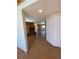 Inviting living room featuring a cozy brick fireplace and neutral tile flooring at 28650 Cavan Ln, Evergreen, CO 80439
