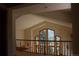 Bright living room featuring tall ceilings and large windows with views of the surrounding greenery at 28650 Cavan Ln, Evergreen, CO 80439