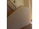 Cozy staircase with wooden banister, leading to the upper level of the home; simple and elegant design at 28650 Cavan Ln, Evergreen, CO 80439