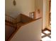 Staircase featuring natural lighting from windows and wood trim at 28650 Cavan Ln, Evergreen, CO 80439