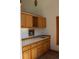 Charming wet bar area with wooden cabinets, ample counter space, and a sink, perfect for entertaining guests at 28650 Cavan Ln, Evergreen, CO 80439