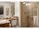 Clean bathroom features granite counters, neutral color schemes, and updated glass enclosed shower at 9188 Buck Hill Dr, Highlands Ranch, CO 80126