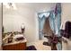 Stylish bathroom features a granite countertop, wood vanity, and decorative curtain over the tub at 9188 Buck Hill Dr, Highlands Ranch, CO 80126