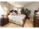 Comfortable bedroom with classic wood furniture and ample natural light offers a relaxing retreat at 9188 Buck Hill Dr, Highlands Ranch, CO 80126