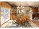 A dining room with traditional wooden table and chairs, and natural lighting at 9188 Buck Hill Dr, Highlands Ranch, CO 80126