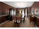 Formal dining room with custom window treatments and elegant lighting at 9188 Buck Hill Dr, Highlands Ranch, CO 80126