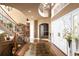 Spacious foyer with hardwood floors, staircase, and decorative accents at 9188 Buck Hill Dr, Highlands Ranch, CO 80126