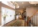 Grand foyer with hardwood floors, a chandelier, and staircase at 9188 Buck Hill Dr, Highlands Ranch, CO 80126