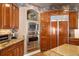 A kitchen with updated stainless steel appliances and custom wooden cabinets at 9188 Buck Hill Dr, Highlands Ranch, CO 80126