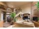 Comfortable living room featuring a fireplace, staircase, and plush furnishings at 9188 Buck Hill Dr, Highlands Ranch, CO 80126