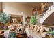 Inviting living room with comfortable seating and open access to the dining area at 9188 Buck Hill Dr, Highlands Ranch, CO 80126