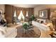 A living room featuring a sitting area, custom curtains, and a decorative rug at 9188 Buck Hill Dr, Highlands Ranch, CO 80126