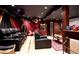 Home theater offers plush seating, vintage decor, and a classic popcorn machine for movie nights at 9188 Buck Hill Dr, Highlands Ranch, CO 80126