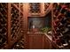 Walk-in wine cellar featuring custom racking for extensive bottle storage and a tasting area at 9188 Buck Hill Dr, Highlands Ranch, CO 80126