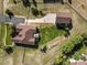Overhead view of home and detached garage with surrounding landscaping and grass at 42340 Kingsmill Cir, Elizabeth, CO 80107