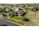 Lovely home showing its detached garage, nice driveway, and picturesque landscaping in an aerial view at 42340 Kingsmill Cir, Elizabeth, CO 80107