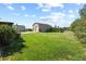 Spacious backyard with large detached garage and plenty of room for recreation at 42340 Kingsmill Cir, Elizabeth, CO 80107