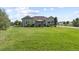 Expansive backyard with lush green lawn and a gazebo perfect for outdoor gatherings at 42340 Kingsmill Cir, Elizabeth, CO 80107